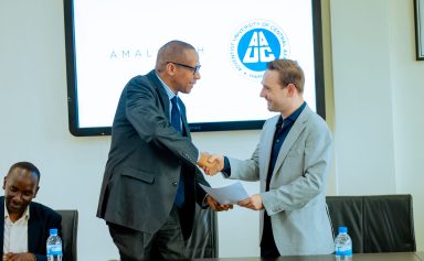 A warm handshake between Christian, AmaliTech's COO, and a representative of AUCA.